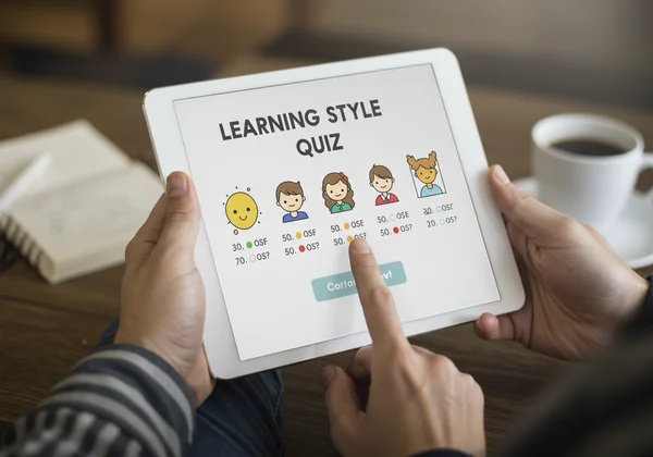 User taking a learning style quiz on a tablet.